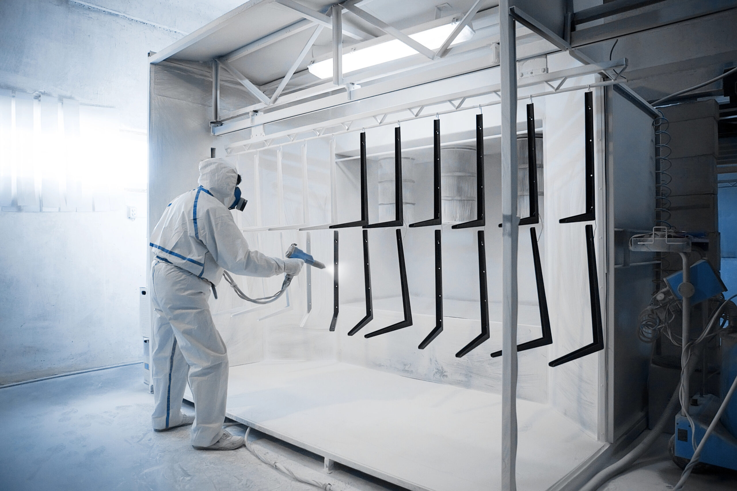 Worker applying Powder Coat